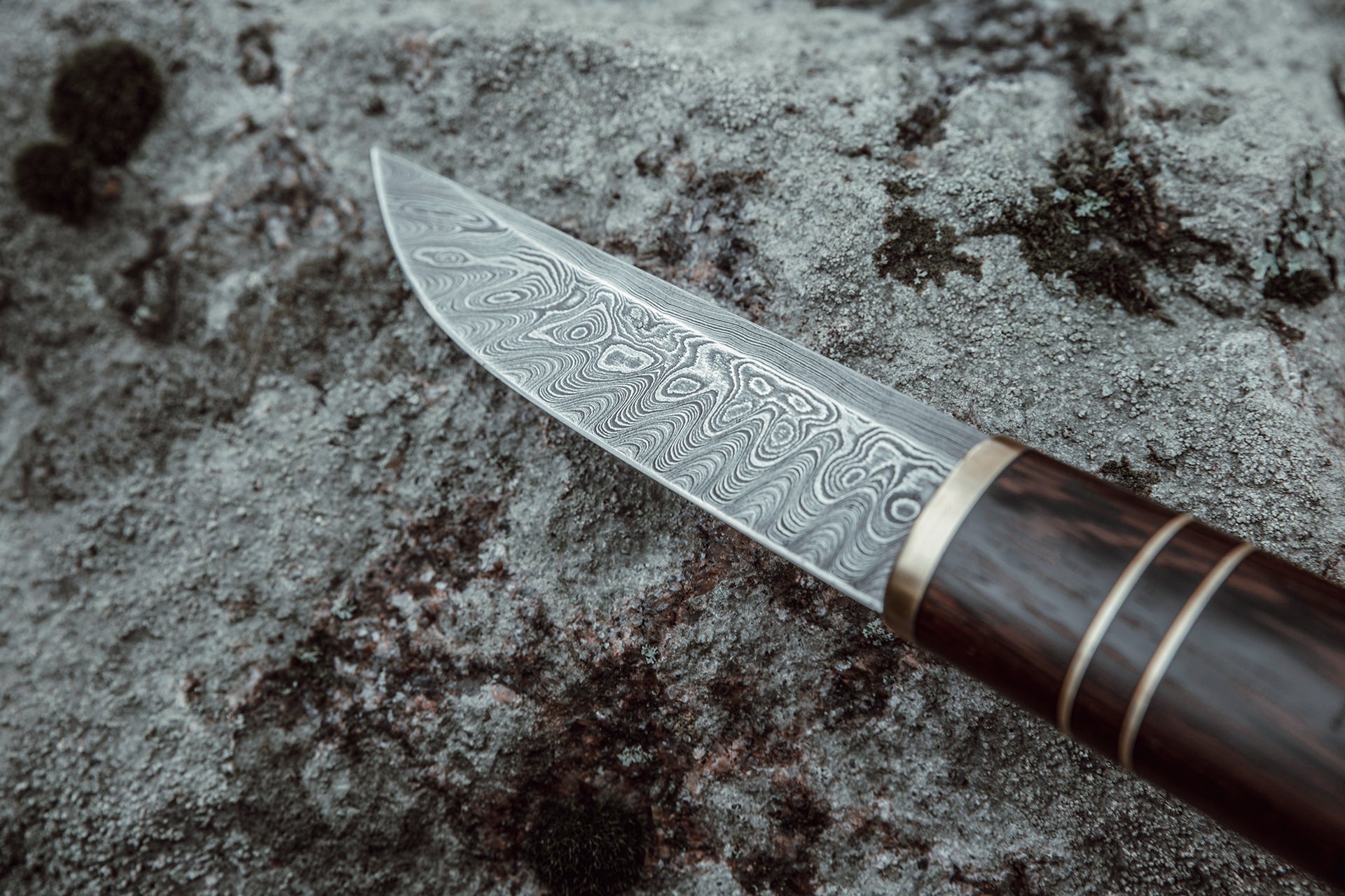 Custom made Bear's Claw shaped knife. Handforged carbon steel Damascus blade