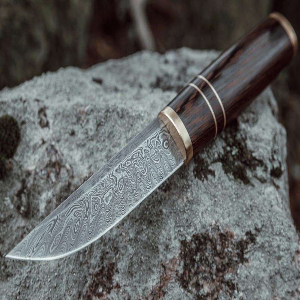 Custom made Bear's Claw shaped knife. Handforged carbon steel Damascus blade