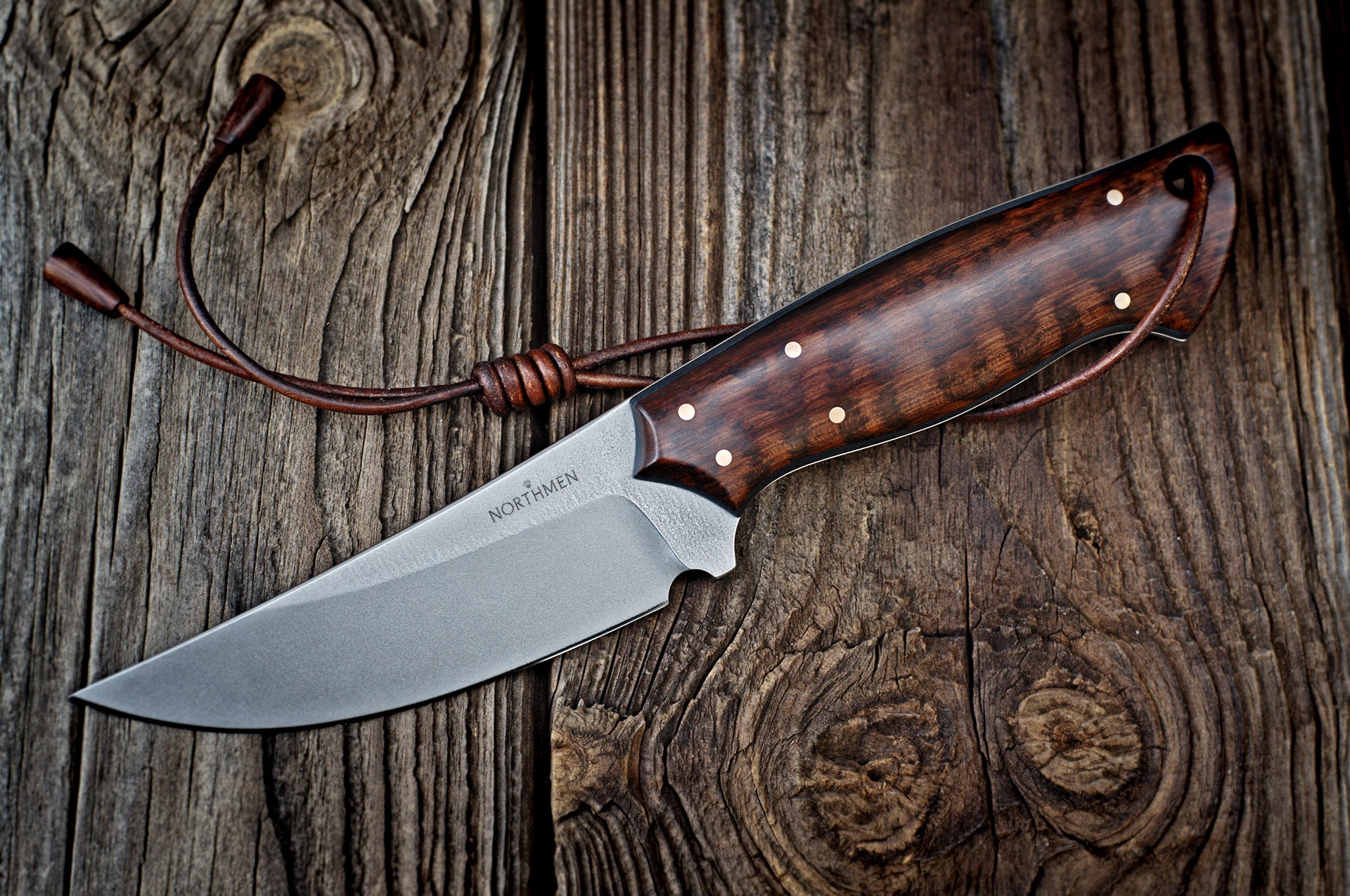 Custom made Bear's Claw shaped knife. Handforged carbon steel Damascus blade