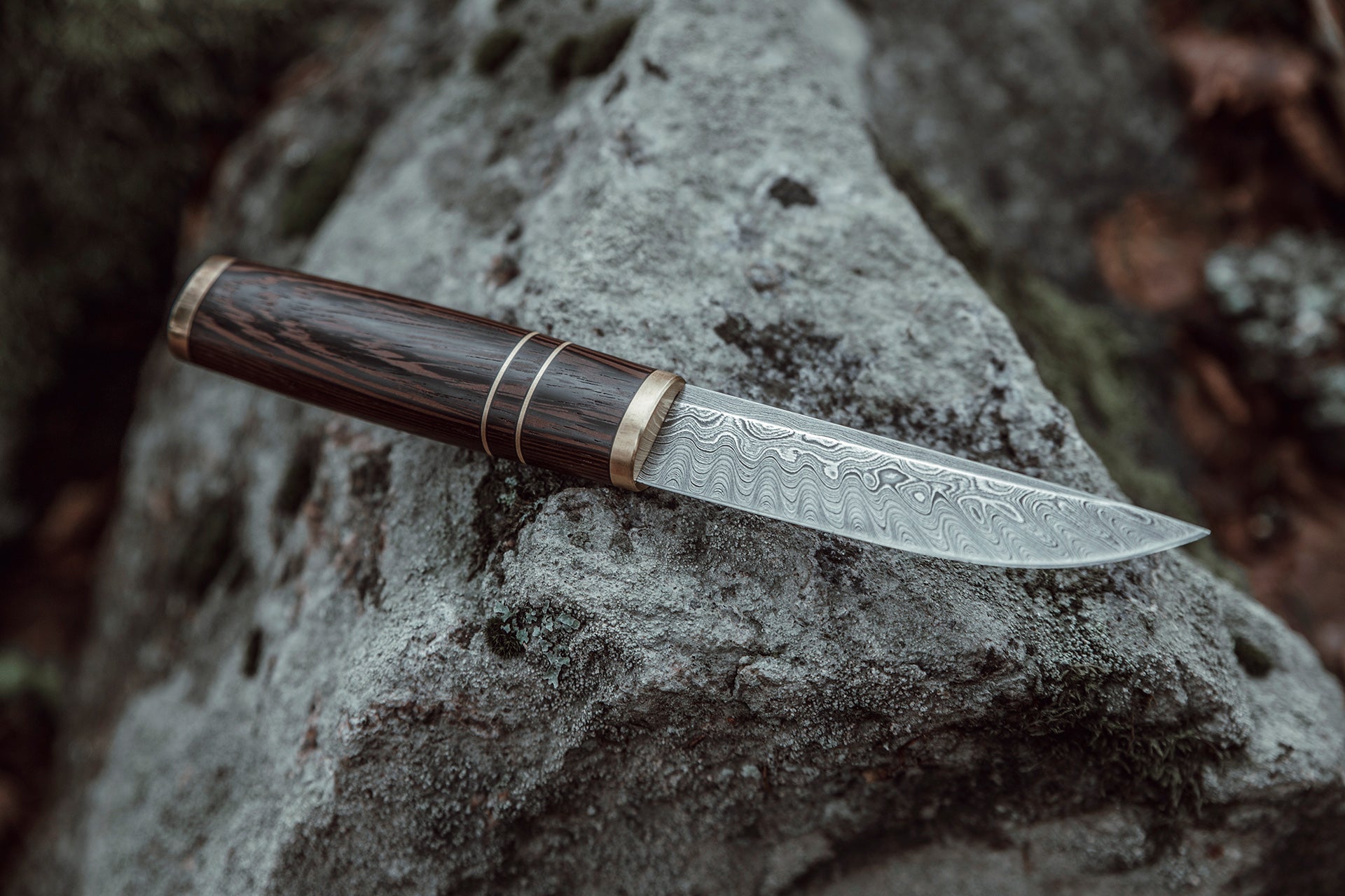 Custom made Bear's Claw shaped knife. Handforged carbon steel Damascus blade