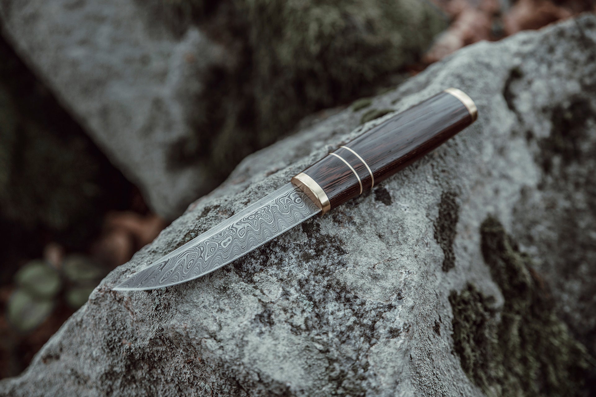 Custom made Bear's Claw shaped knife. Handforged carbon steel Damascus blade